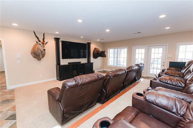 living area with recessed lighting, visible vents, and baseboards