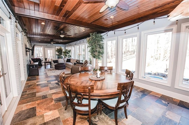 sunroom with wooden ceiling and a ceiling fan