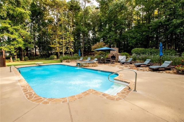 outdoor pool featuring a patio area