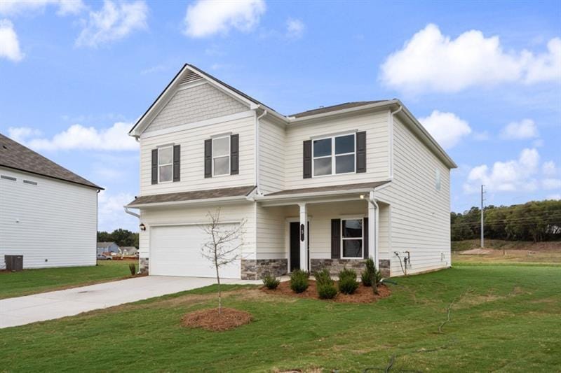 craftsman-style home featuring a front yard and a garage