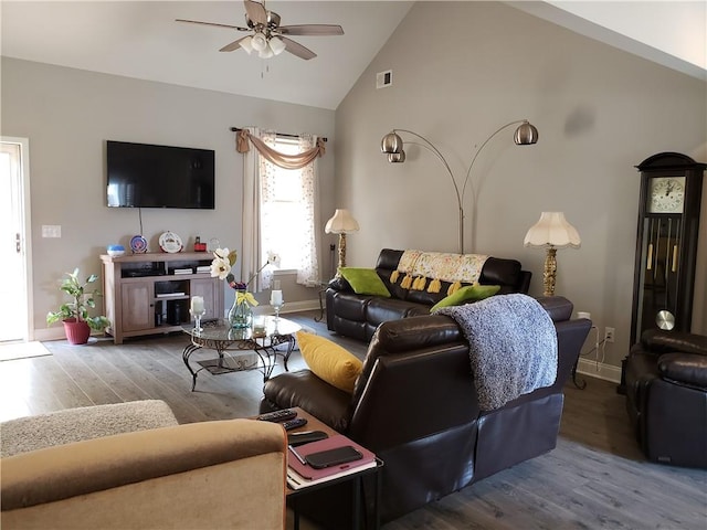 living room with ceiling fan, wood-type flooring, and lofted ceiling