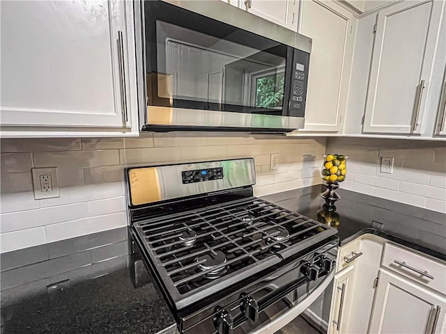 3150 Stratford Green Pl, Avondale Estates, GA 30002 - kitchen with stainless steel appliances, decorative backsplash, and white cabinetry