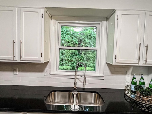 3150 Stratford Green Pl, Avondale Estates, GA 30002 - kitchen featuring dark countertops, white cabinetry, and tasteful backsplash