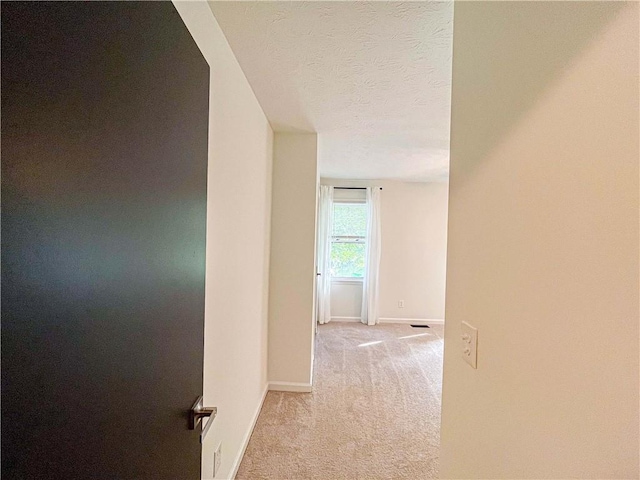 3150 Stratford Green Pl, Avondale Estates, GA 30002 - hallway with light carpet and a textured ceiling