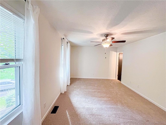 3150 Stratford Green Pl, Avondale Estates, GA 30002 - spare room featuring light colored carpet, a ceiling fan, and a textured ceiling