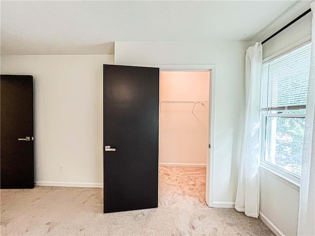 3150 Stratford Green Pl, Avondale Estates, GA 30002 - unfurnished bedroom with multiple windows, a spacious closet, carpet, and a closet