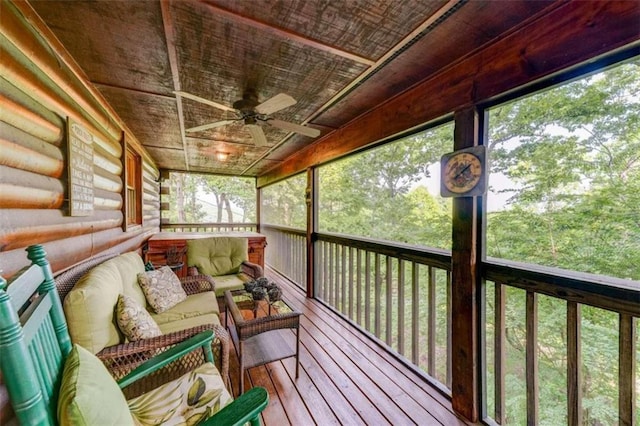 unfurnished sunroom with ceiling fan and a healthy amount of sunlight