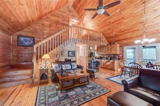 living room featuring high vaulted ceiling, wooden walls, wood ceiling, and wood-type flooring