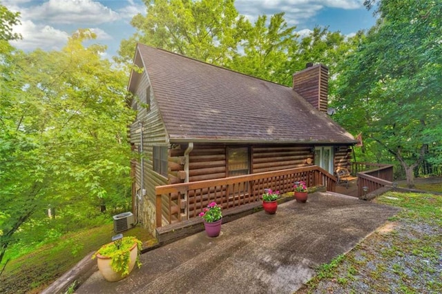 652 Fox Run Dr, Blue Ridge, GA 30513 - cabin with log siding, a chimney, cooling unit, and a wooden deck