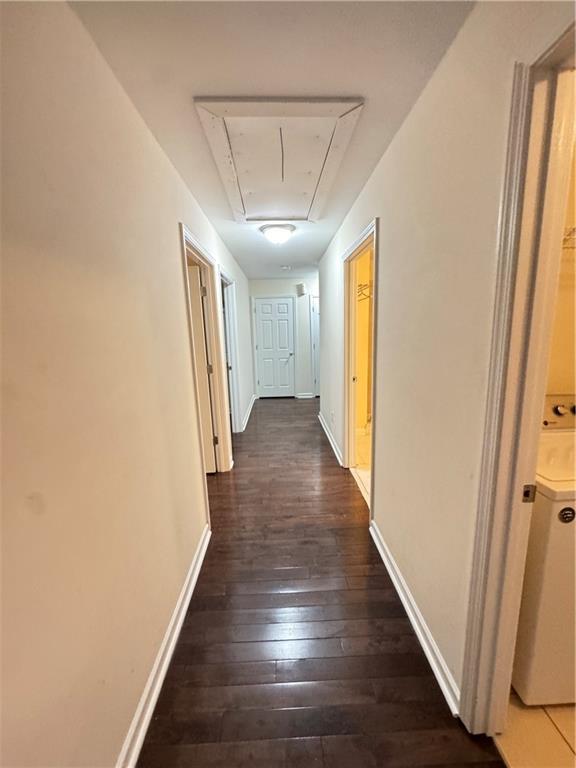 bedroom with dark hardwood / wood-style floors