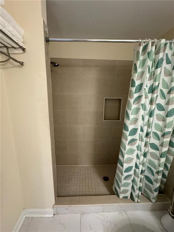 bathroom with a shower with shower curtain