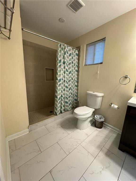 bathroom with vanity, toilet, and a shower with shower curtain