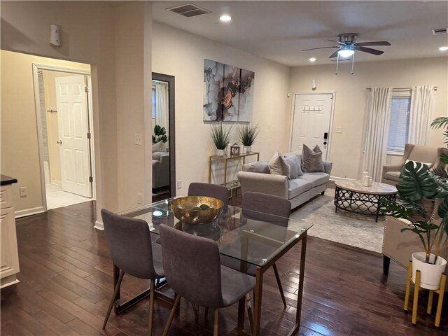 interior space featuring dark hardwood / wood-style flooring and a stone fireplace