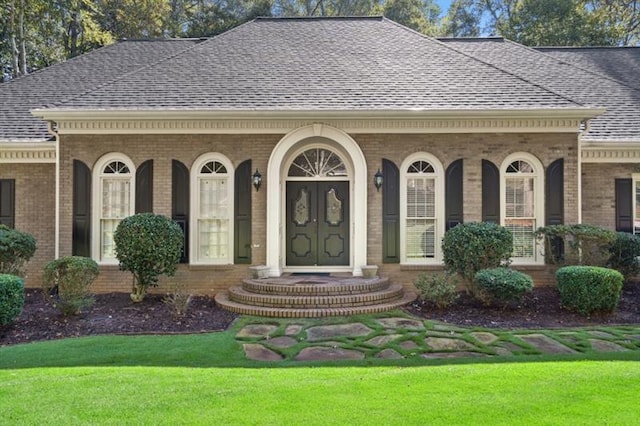1585 Lazy River Ln, Sandy Springs, GA 30350 - doorway to property with roof with shingles, a yard, and brick siding