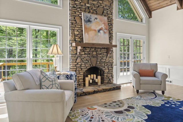 1585 Lazy River Ln, Sandy Springs, GA 30350 - living area with lofted ceiling with beams, wainscoting, wood finished floors, and plenty of natural light