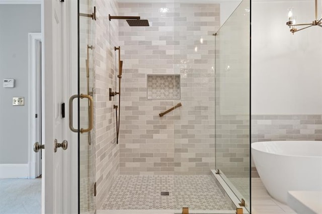 1585 Lazy River Ln, Sandy Springs, GA 30350 - bathroom featuring a freestanding bath, a shower stall, and an inviting chandelier