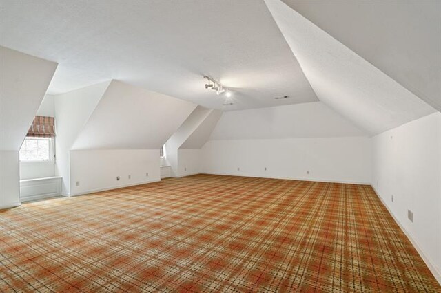 1585 Lazy River Ln, Sandy Springs, GA 30350 - bonus room with vaulted ceiling and light colored carpet