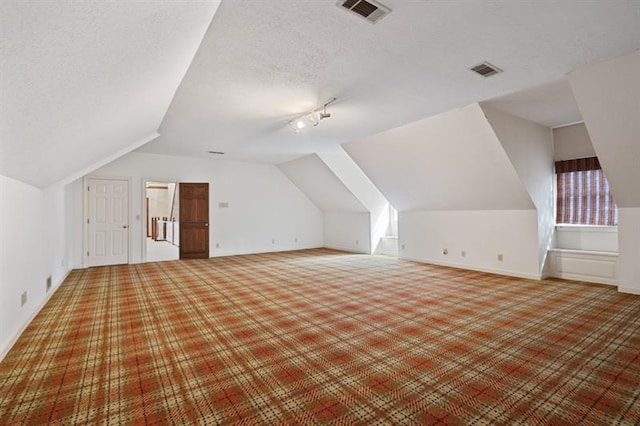 1585 Lazy River Ln, Sandy Springs, GA 30350 - bonus room featuring lofted ceiling, visible vents, baseboards, and carpet floors