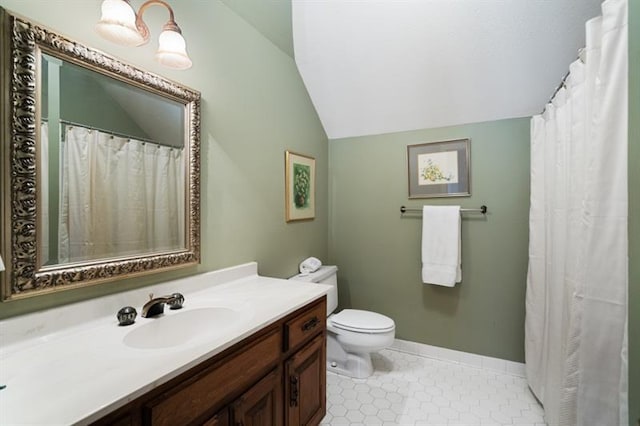 1585 Lazy River Ln, Sandy Springs, GA 30350 - bathroom featuring baseboards, toilet, vaulted ceiling, tile patterned floors, and vanity