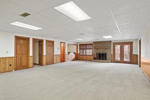 1585 Lazy River Ln, Sandy Springs, GA 30350 - unfurnished living room featuring visible vents, a drop ceiling, and wainscoting