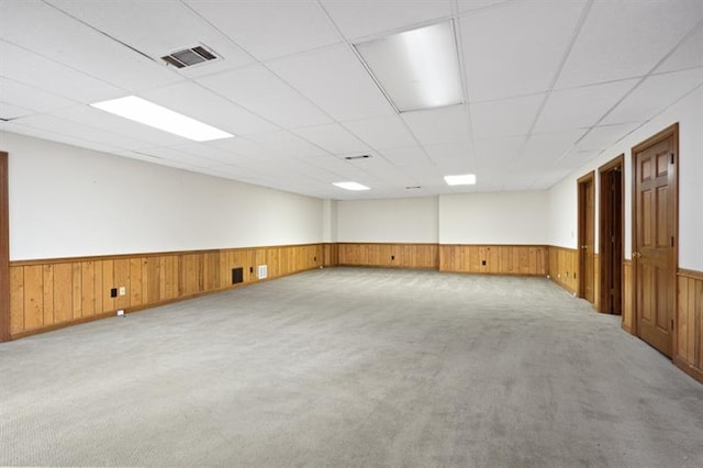 1585 Lazy River Ln, Sandy Springs, GA 30350 - unfurnished room featuring carpet, wood walls, a wainscoted wall, visible vents, and a paneled ceiling