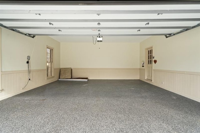 1585 Lazy River Ln, Sandy Springs, GA 30350 - garage with a garage door opener and a wainscoted wall