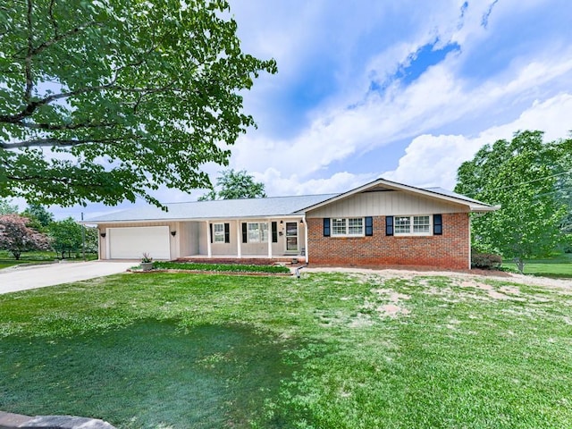 ranch-style house featuring a garage, concrete driveway, a front lawn, and brick siding