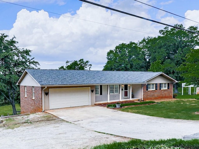 ranch-style home with a garage, concrete driveway, a front lawn, brick siding, and covered porch