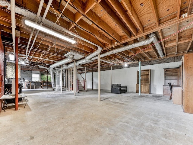 unfinished below grade area featuring stairway