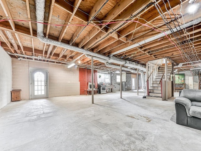 below grade area with stairway and plenty of natural light