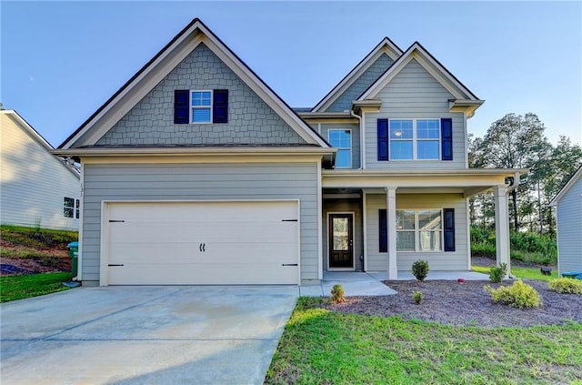 craftsman-style home featuring a porch and a garage