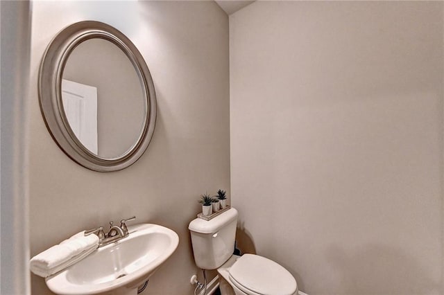 bathroom featuring sink and toilet