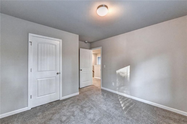 unfurnished bedroom featuring light carpet