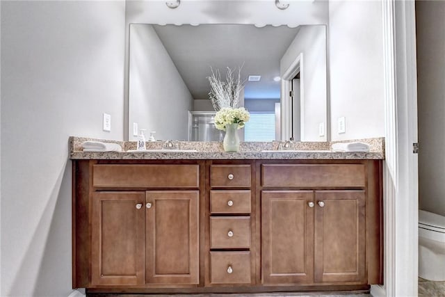 bathroom with vanity and toilet