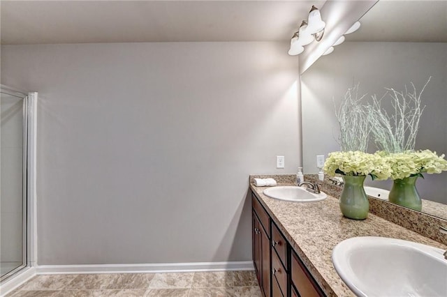 bathroom featuring walk in shower and vanity