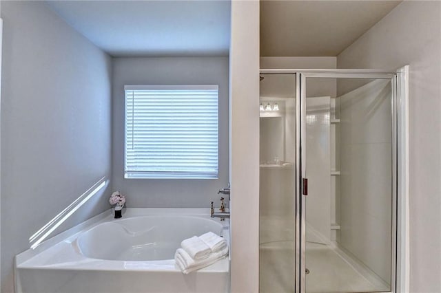 bathroom with separate shower and tub