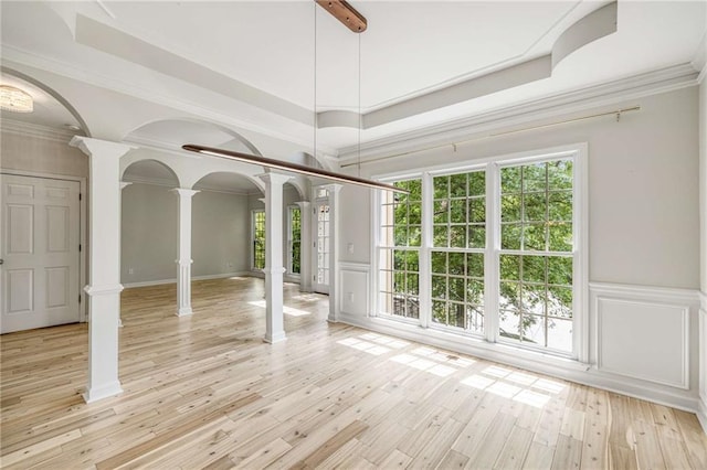 600 Oakmont Hl, Duluth, GA 30097 - spare room with ornate columns, a decorative wall, healthy amount of natural light, light wood-style floors, and a wainscoted wall