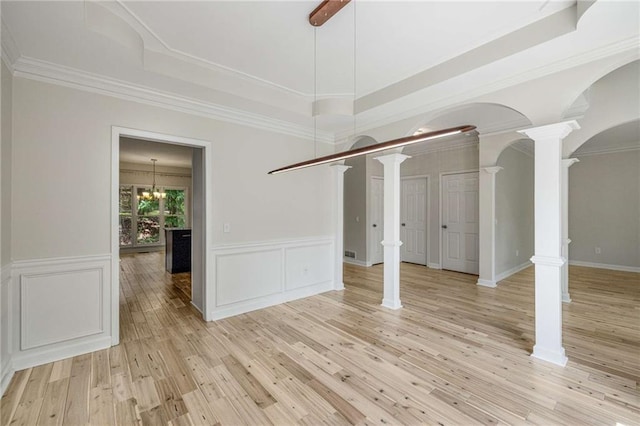 600 Oakmont Hl, Duluth, GA 30097 - unfurnished room featuring decorative columns, light wood-type flooring, ornamental molding, a decorative wall, and wainscoting