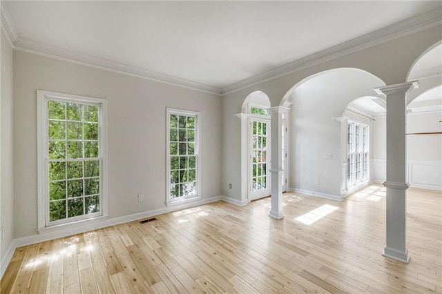 600 Oakmont Hl, Duluth, GA 30097 - unfurnished room with decorative columns, light wood-type flooring, crown molding, and arched walkways