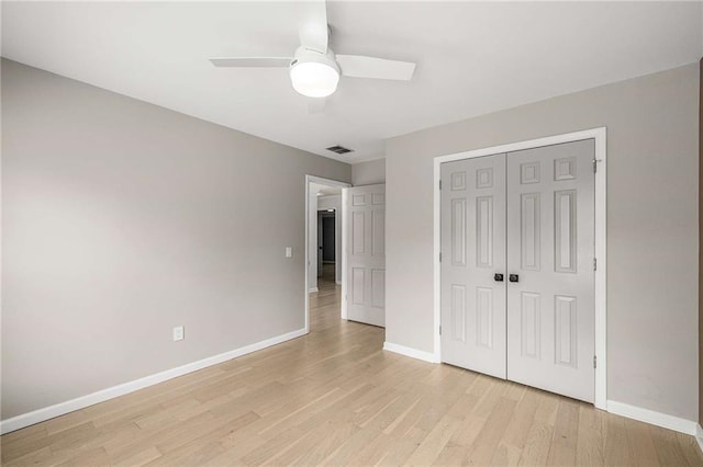 600 Oakmont Hl, Duluth, GA 30097 - unfurnished bedroom featuring light wood-style floors, a closet, and ceiling fan