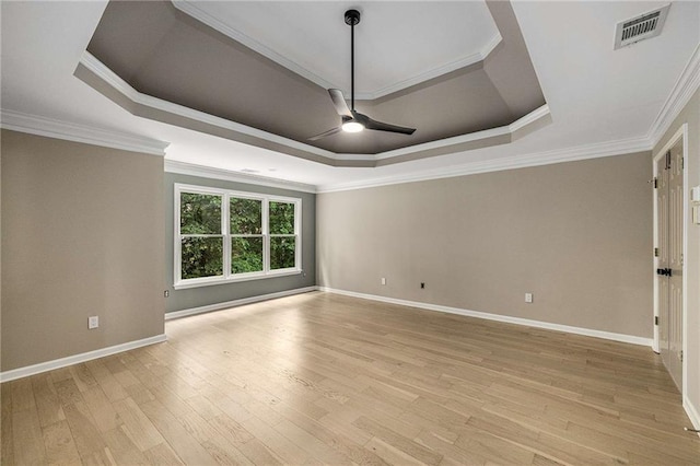 600 Oakmont Hl, Duluth, GA 30097 - unfurnished room with a raised ceiling, ceiling fan, light wood-style floors, and crown molding