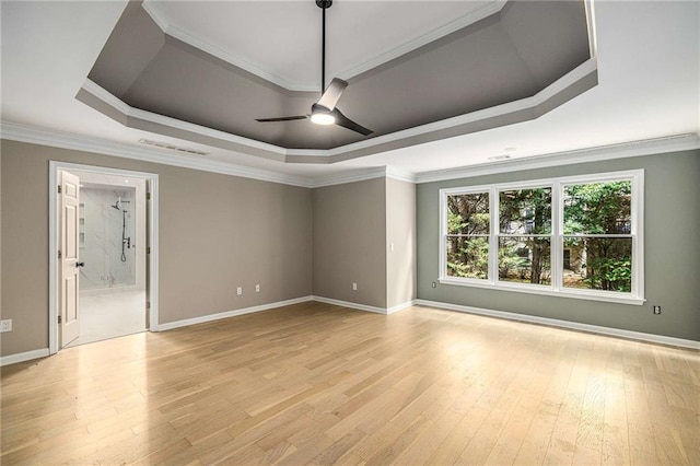 600 Oakmont Hl, Duluth, GA 30097 - unfurnished room featuring a raised ceiling, a ceiling fan, light wood-type flooring, and ornamental molding
