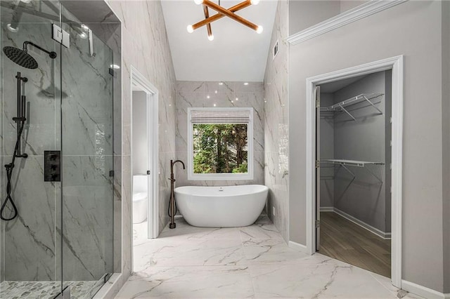 600 Oakmont Hl, Duluth, GA 30097 - full bath with a marble finish shower, marble tiled flooring, a soaking tub, a walk in closet, and vaulted ceiling