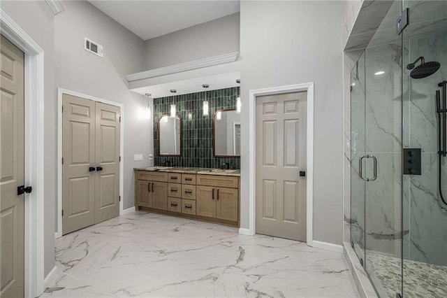 600 Oakmont Hl, Duluth, GA 30097 - full bath with marble look tile flooring, double vanity, a marble finish shower, and a towering ceiling