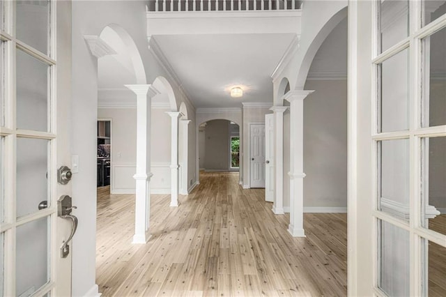 600 Oakmont Hl, Duluth, GA 30097 - foyer entrance with arched walkways, crown molding, and light wood-style floors