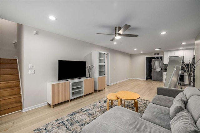 600 Oakmont Hl, Duluth, GA 30097 - living area with light wood finished floors, stairway, a ceiling fan, and recessed lighting