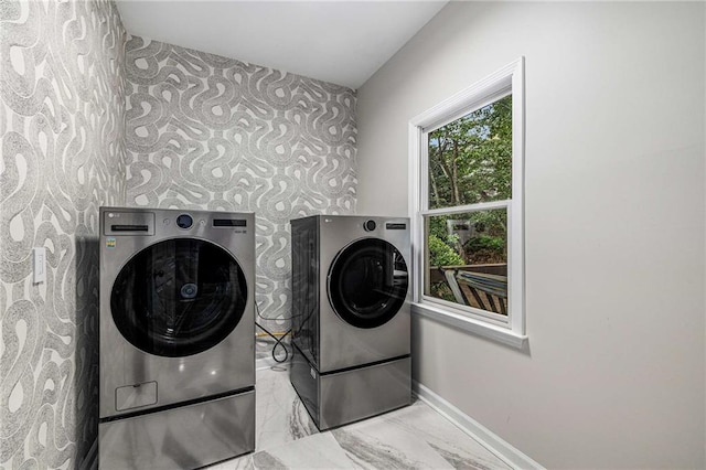 600 Oakmont Hl, Duluth, GA 30097 - washroom with washer and dryer, wallpapered walls, marble look tiles, and an accent wall
