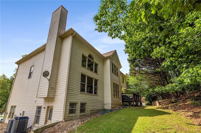 600 Oakmont Hl, Duluth, GA 30097 - view of home's exterior with a chimney, a yard, and a wooden deck