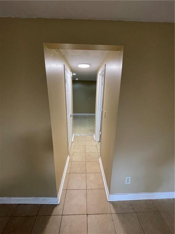 6399 Boca Grande Blvd, Forest Park, GA 30297 - hall with baseboards and light tile patterned floors
