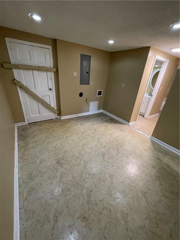 6399 Boca Grande Blvd, Forest Park, GA 30297 - clothes washing area featuring recessed lighting, baseboards, electric panel, and a textured ceiling